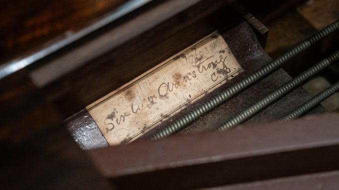 A label under the lid of Cragside's Broadwood Piano reading "Sir Wm. Armstrong".